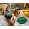 This image shows the battery-operated candle included in your purchase. The candle lights up the carved elf face and has a timer setting.